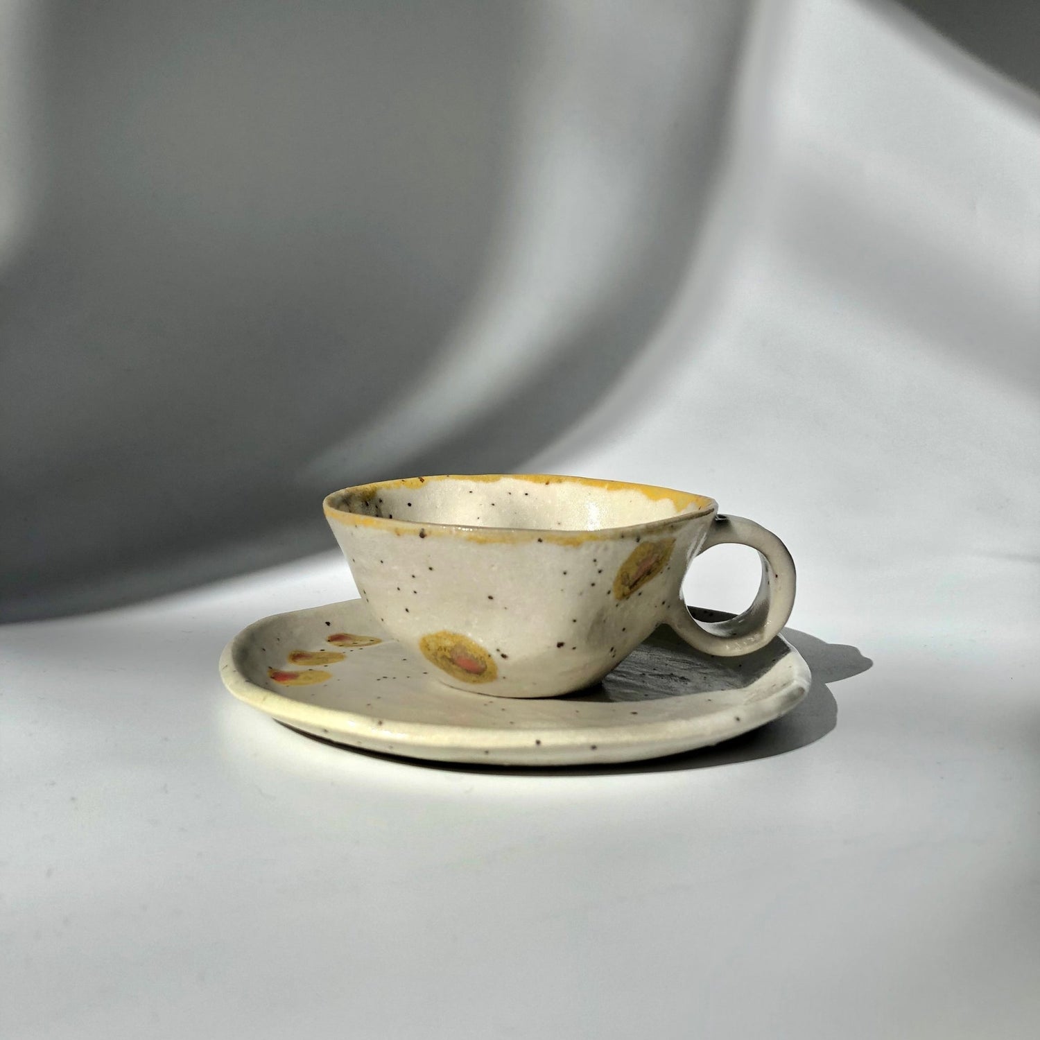 Hiroshi Hirai: Heart Shaped Cup & Saucer Set, Yellow Accents - Yunomi.life