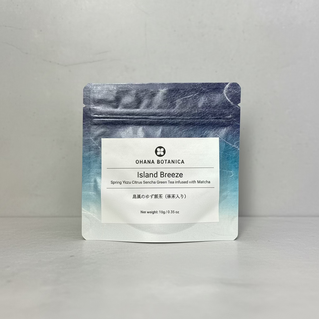 A packaged tea product labeled 'Island Breeze' by Ohana Botanica, featuring a blend of green tea and yuzu citrus, displayed against a neutral background.