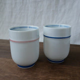 Saikai Ceramics: Red Trim, White Porcelain Yunomi Tea Cup with Blue Accents 150 ml - Yunomi.life